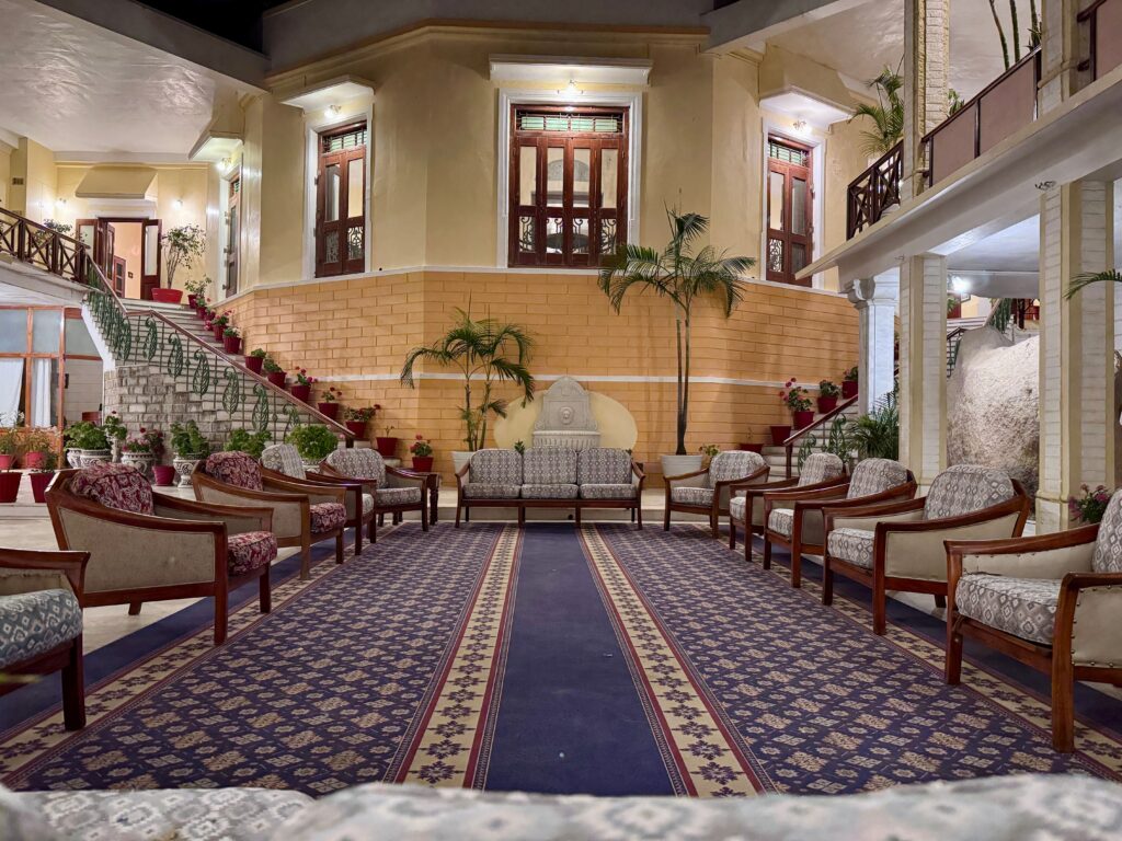 Beautifully arranged seating area in a villa lobby with elegant decor and intricate design.